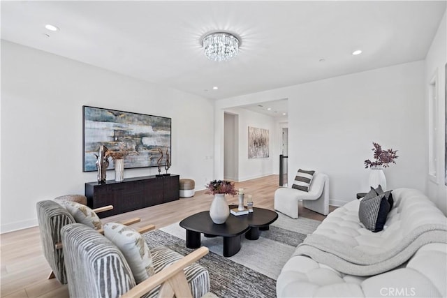 51 Eider Run, Irvine, CA 92618 - living room with light wood-type flooring, a chandelier, and recessed lighting