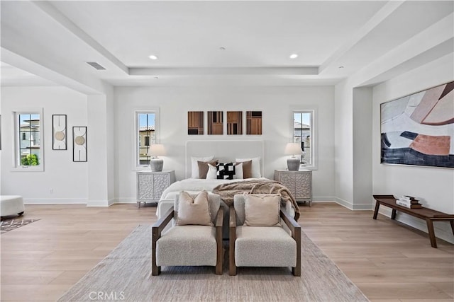 51 Eider Run, Irvine, CA 92618 - bedroom with a tray ceiling, light wood finished floors, multiple windows, and recessed lighting