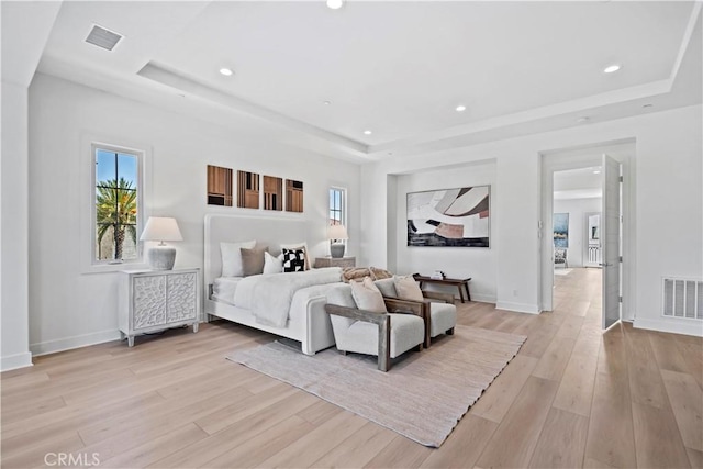 51 Eider Run, Irvine, CA 92618 - bedroom featuring a raised ceiling, multiple windows, light wood-style floors, and recessed lighting