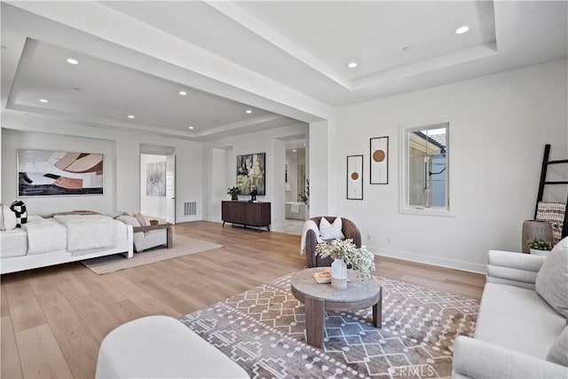 51 Eider Run, Irvine, CA 92618 - living room featuring a raised ceiling, light wood-style flooring, and recessed lighting