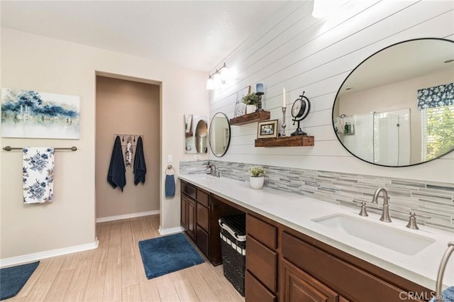 27840 Pointe Breeze Dr, Menifee, CA 92585 - bathroom with tasteful backsplash, double vanity, a shower with shower door, and wood finished floors