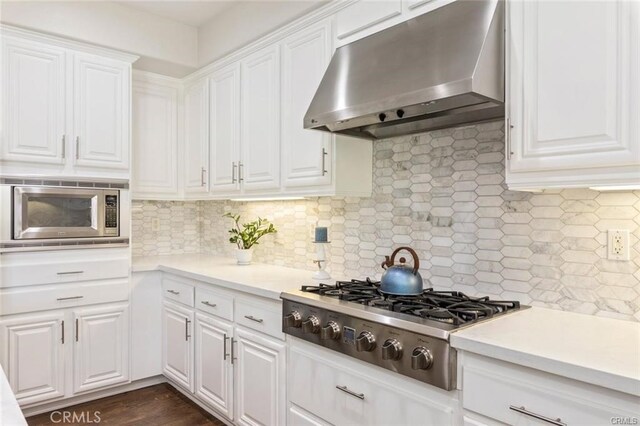 27840 Pointe Breeze Dr, Menifee, CA 92585 - kitchen featuring exhaust hood, stainless steel appliances, light countertops, and white cabinetry
