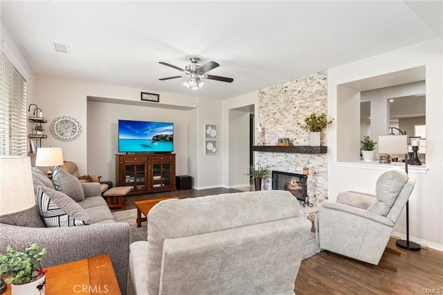 27840 Pointe Breeze Dr, Menifee, CA 92585 - living room with wood finished floors, a ceiling fan, and a fireplace