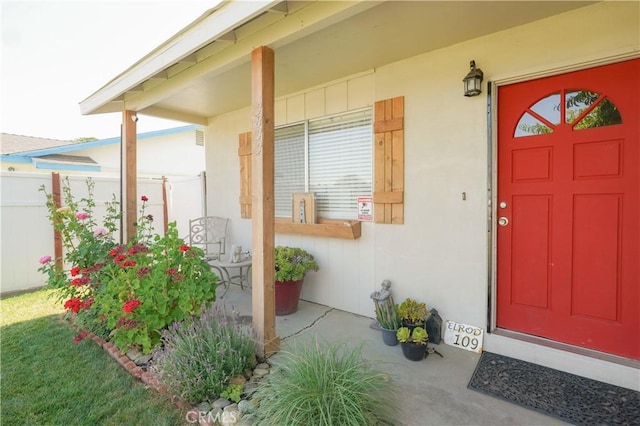 3833 Kennedy St, Le Grand, CA 95333 - doorway to property featuring a porch and stucco siding