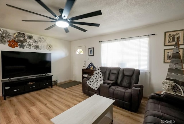 3833 Kennedy St, Le Grand, CA 95333 - living area with light wood-style floors, ceiling fan, and a textured ceiling