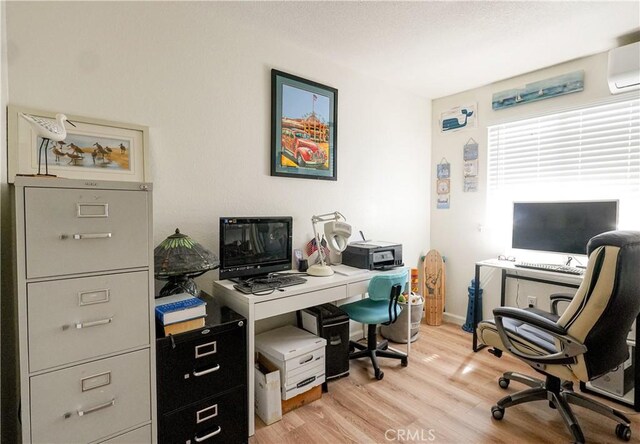 3833 Kennedy St, Le Grand, CA 95333 - office area with light wood-style flooring and a wall unit AC