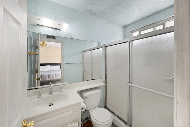 6859 Mango St, Rancho Cucamonga, CA 91701 - ensuite bathroom featuring vanity, a shower stall, a textured ceiling, and a ceiling fan