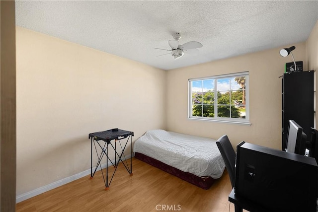 6859 Mango St, Rancho Cucamonga, CA 91701 - bedroom with wood finished floors, a textured ceiling, and a ceiling fan