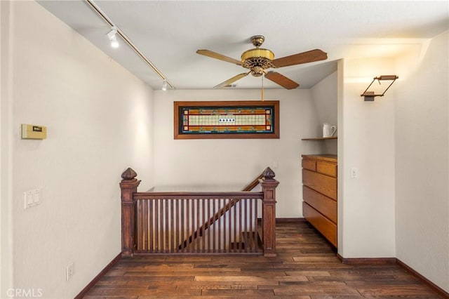 335 Rainbow Crest Rd, Fallbrook, CA 92028 - hallway with an upstairs landing, rail lighting, dark wood finished floors, and baseboards