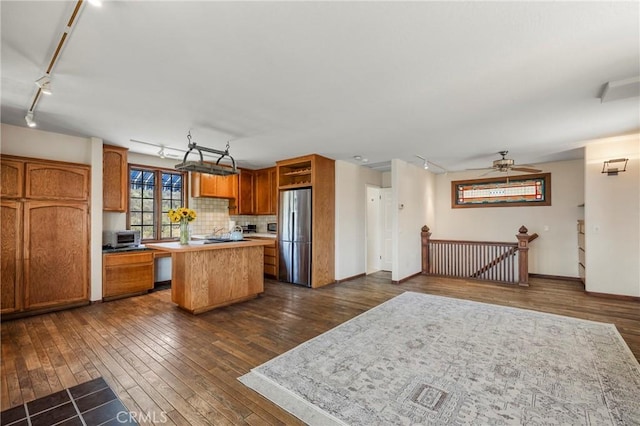 335 Rainbow Crest Rd, Fallbrook, CA 92028 - kitchen with freestanding refrigerator, track lighting, a kitchen island, dark wood-style floors, and light countertops