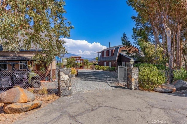 335 Rainbow Crest Rd, Fallbrook, CA 92028 - view of asphalt driveway featuring a gated entry and a gate
