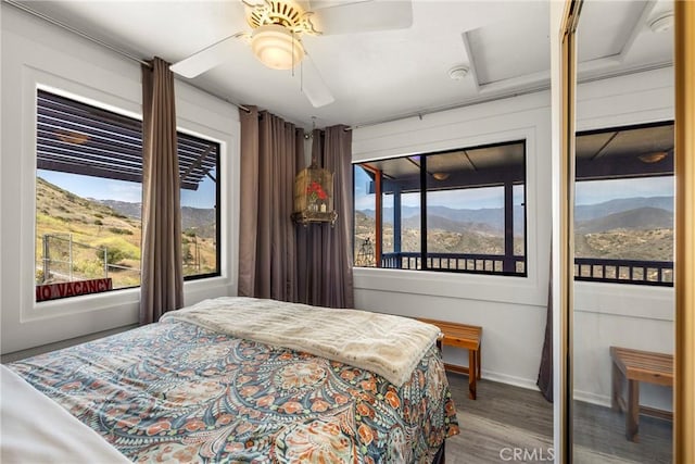 335 Rainbow Crest Rd, Fallbrook, CA 92028 - bedroom with attic access, a mountain view, wood finished floors, baseboards, and access to outside