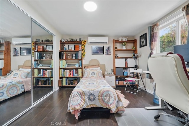 4819 Church St, Pico Rivera, CA 90660 - bedroom featuring a wall unit AC and wood finished floors