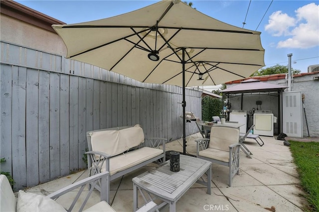 4819 Church St, Pico Rivera, CA 90660 - view of patio featuring a gazebo, washer and clothes dryer, and outdoor dining area