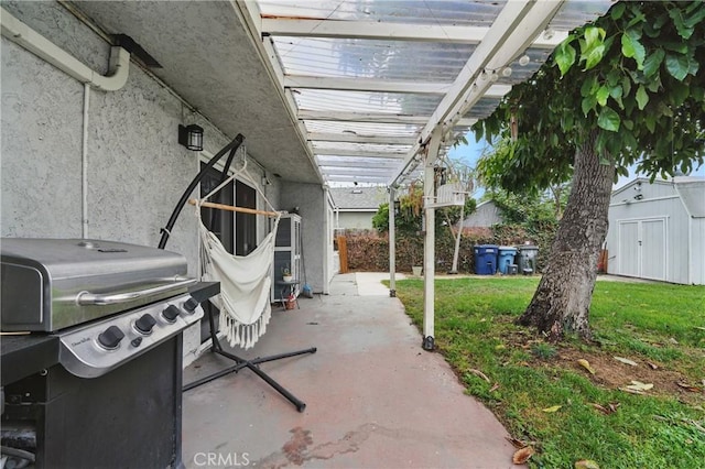 4819 Church St, Pico Rivera, CA 90660 - view of patio with grilling area, a pergola, and a storage unit