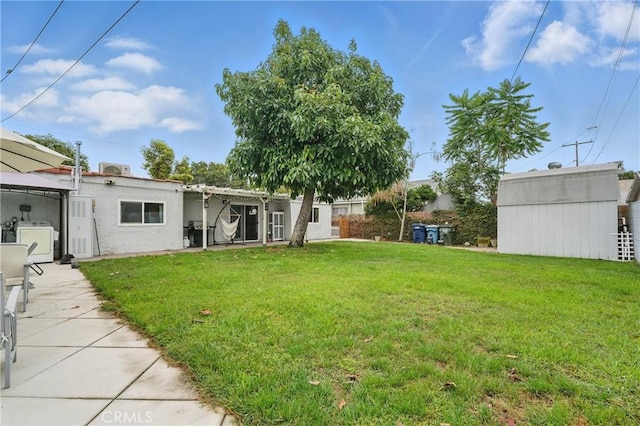 4819 Church St, Pico Rivera, CA 90660 - view of grassy yard featuring a gazebo, independent washer and dryer, and an outbuilding