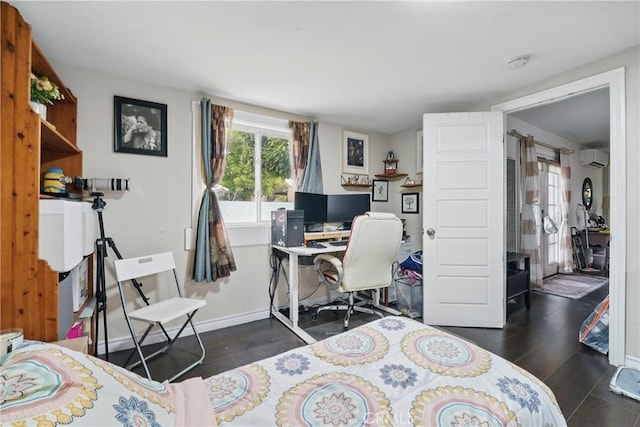 4819 Church St, Pico Rivera, CA 90660 - bedroom featuring dark wood-style floors, a wall mounted air conditioner, a desk, and baseboards