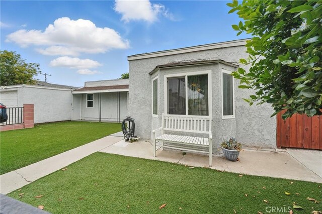 4819 Church St, Pico Rivera, CA 90660 - back of property featuring stucco siding and a patio