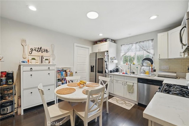 4819 Church St, Pico Rivera, CA 90660 - kitchen featuring stainless steel appliances, a sink, backsplash, dark wood finished floors, and recessed lighting