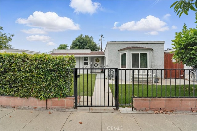 4819 Church St, Pico Rivera, CA 90660 - view of front of home with a fenced front yard, a gate, and stucco siding