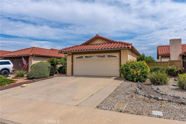 26181 Goldenwood St, Menifee, CA 92586 - mediterranean / spanish-style home with a tile roof, stucco siding, concrete driveway, and a garage