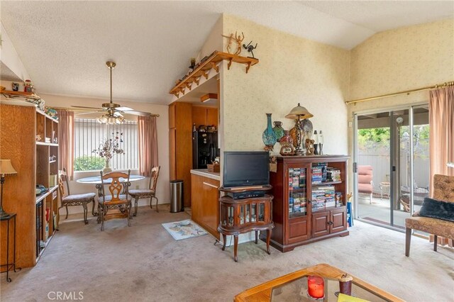 26181 Goldenwood St, Menifee, CA 92586 - living room featuring healthy amount of natural light, ceiling fan, light carpet, and lofted ceiling