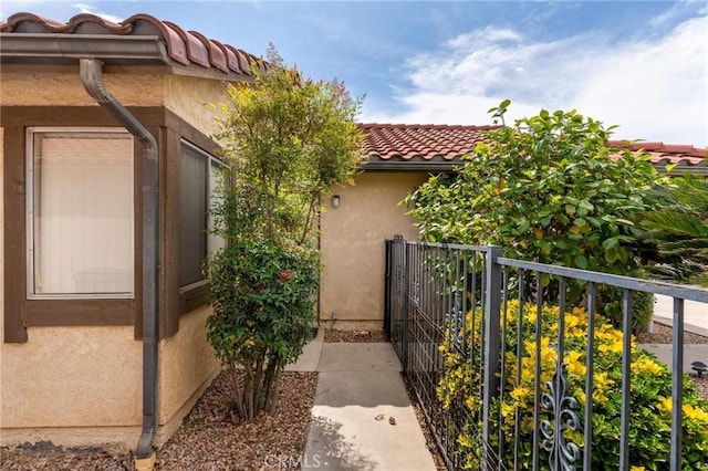 26181 Goldenwood St, Menifee, CA 92586 - view of property exterior with a tiled roof and stucco siding