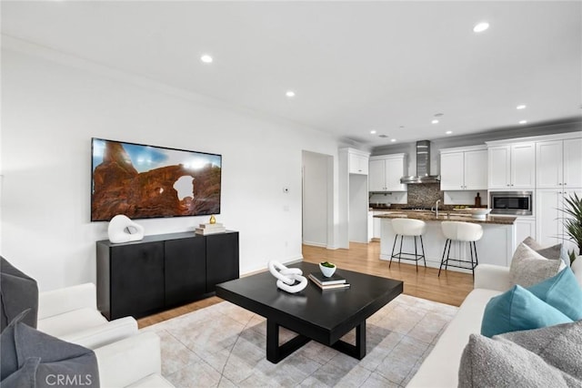 156 Barrow, Irvine, CA 92620 - living room with light wood-style floors and recessed lighting