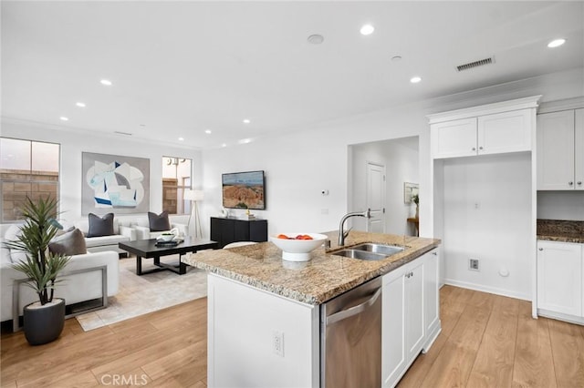 156 Barrow, Irvine, CA 92620 - kitchen featuring dishwasher, a sink, light wood finished floors, white cabinets, and light stone counters