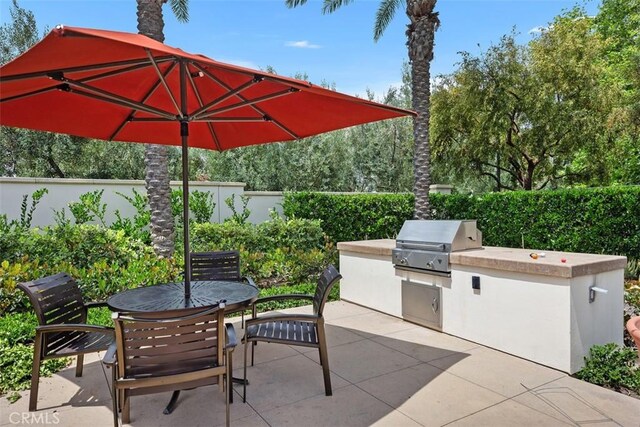 156 Barrow, Irvine, CA 92620 - fenced backyard featuring a patio and outdoor dining space