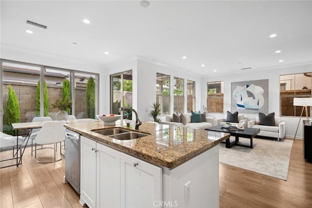 156 Barrow, Irvine, CA 92620 - kitchen featuring a sink, open floor plan, light wood finished floors, stainless steel dishwasher, and crown molding