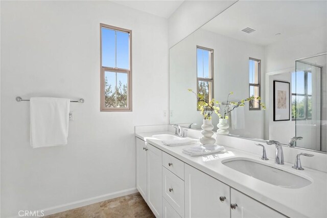 156 Barrow, Irvine, CA 92620 - full bathroom featuring double vanity and baseboards