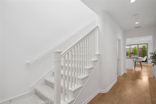 156 Barrow, Irvine, CA 92620 - staircase featuring wood finished floors, recessed lighting, and baseboards
