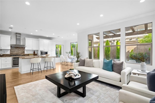 156 Barrow, Irvine, CA 92620 - living area featuring recessed lighting, light wood finished floors, and crown molding