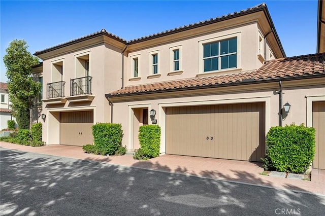 156 Barrow, Irvine, CA 92620 - view of front of house with a garage, a tiled roof, stucco siding, and decorative driveway