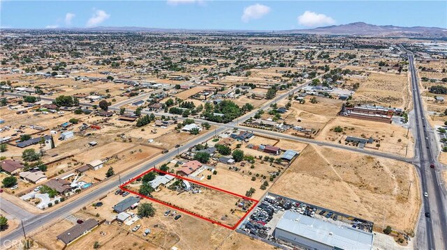 11225 1st St, Hesperia, CA 92345 - aerial view of property's location featuring property parcel outlined and mountains
