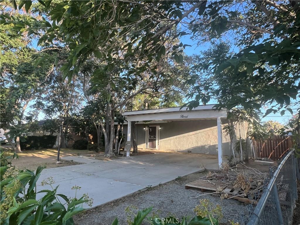 16275 Cajon St, Hesperia, CA 92345 - back of property with a carport, concrete driveway, and stucco siding