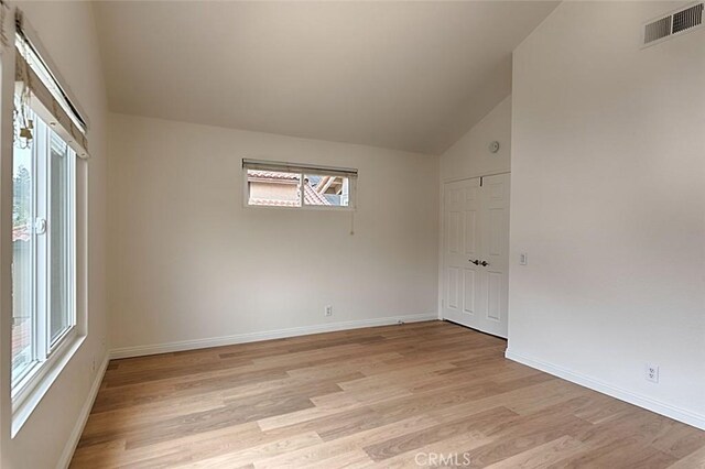 24650 Via Melinda, Yorba Linda, CA 92887 - empty room featuring light wood-type flooring, lofted ceiling, and baseboards