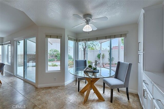 24650 Via Melinda, Yorba Linda, CA 92887 - dining room featuring healthy amount of natural light, baseboards, a textured ceiling, a ceiling fan, and light tile patterned floors