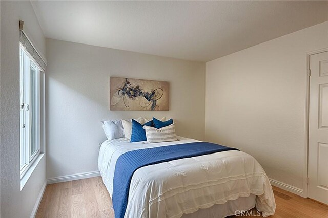 24650 Via Melinda, Yorba Linda, CA 92887 - bedroom featuring light wood finished floors and baseboards