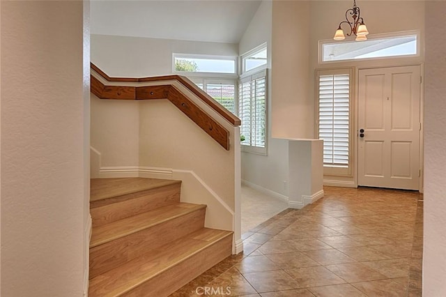 24650 Via Melinda, Yorba Linda, CA 92887 - tiled entrance foyer with a chandelier, stairs, vaulted ceiling, and baseboards
