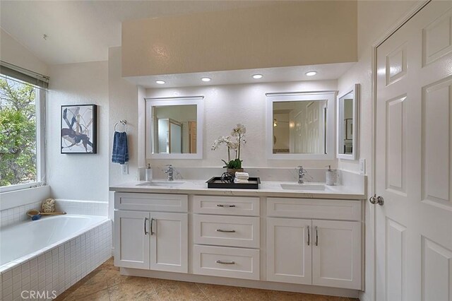 24650 Via Melinda, Yorba Linda, CA 92887 - full bathroom featuring double vanity, a bath, and vaulted ceiling