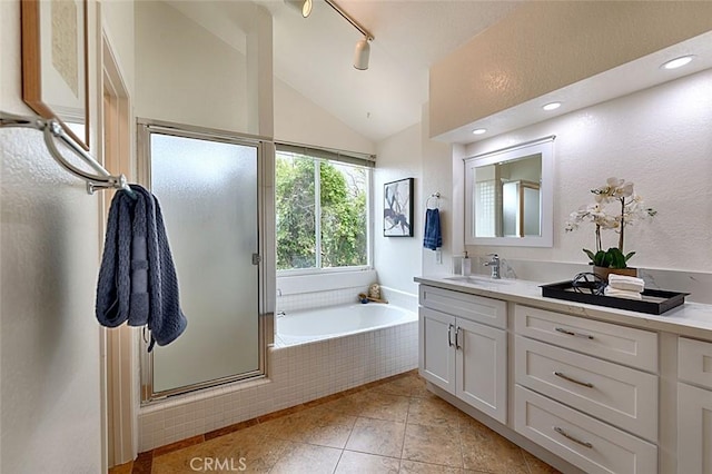 24650 Via Melinda, Yorba Linda, CA 92887 - bathroom with vanity, a garden tub, lofted ceiling, a stall shower, and tile patterned floors