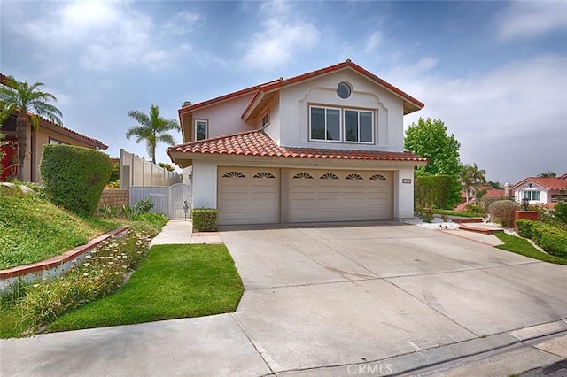 24650 Via Melinda, Yorba Linda, CA 92887 - mediterranean / spanish house featuring stucco siding, driveway, a garage, a gate, and a tile roof