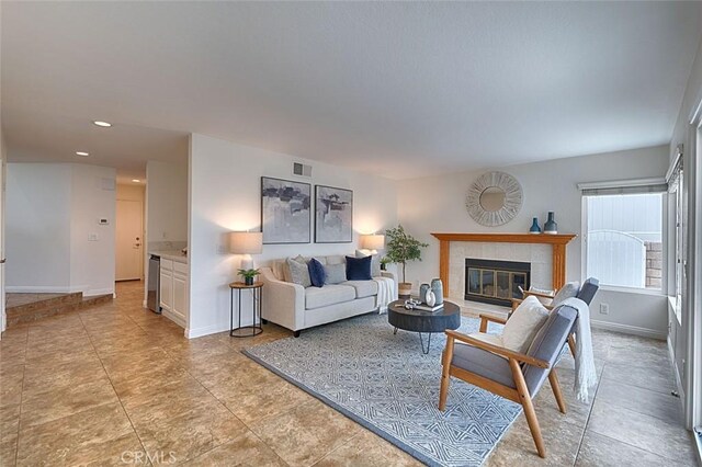 24650 Via Melinda, Yorba Linda, CA 92887 - living room featuring a tiled fireplace, baseboards, recessed lighting, and light tile patterned floors