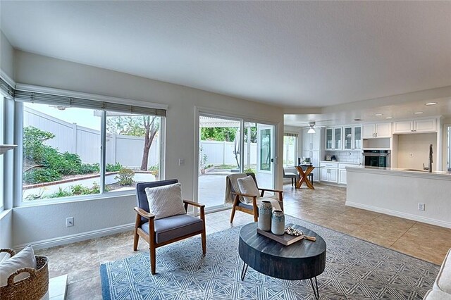 24650 Via Melinda, Yorba Linda, CA 92887 - living area with healthy amount of natural light, baseboards, light tile patterned floors, ceiling fan, and recessed lighting