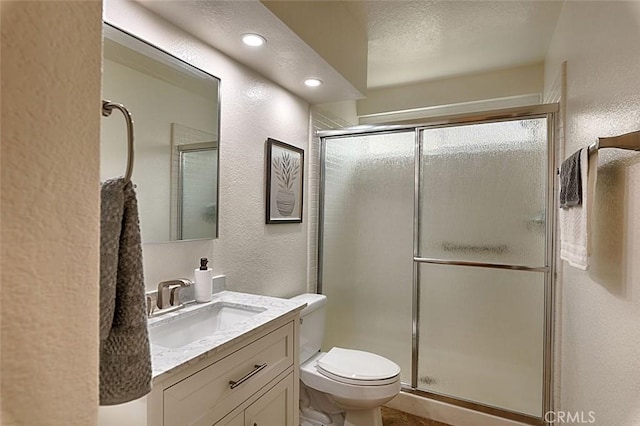 24650 Via Melinda, Yorba Linda, CA 92887 - bathroom featuring a textured wall, vanity, toilet, a shower with shower door, and recessed lighting
