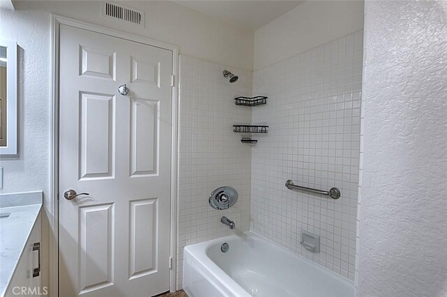 24650 Via Melinda, Yorba Linda, CA 92887 - full bathroom featuring vanity, a textured wall, and washtub / shower combination