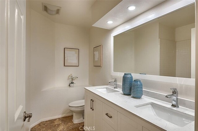 24650 Via Melinda, Yorba Linda, CA 92887 - full bathroom with toilet, double vanity, baseboards, and recessed lighting