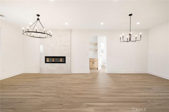 5399 Hickory Way, Paradise, CA 95969 - unfurnished living room featuring a chandelier, light wood-style flooring, baseboards, and recessed lighting